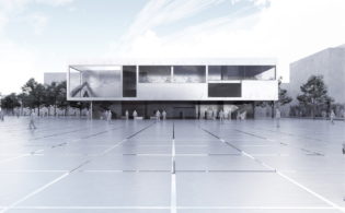 WIDOK Z PLACU NA CZĘŚĆ Z SALAMI ĆWICZEŃ I WEJŚCIE GŁÓWNE DO BUDYNKU